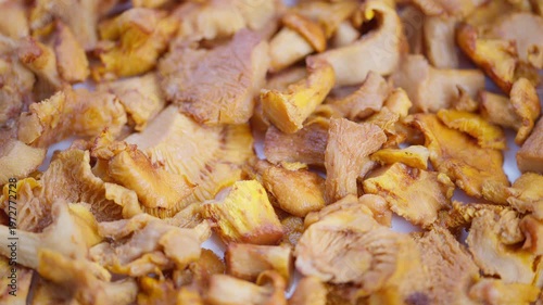 Mushroom display closeup, Appetizing presentation of tender chanterelle mushrooms, Rustic kitchen scene emphasizing fresh and tender chanterelle mushrooms in appealing display