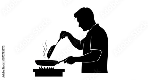 Silhouette of a man cooking food in a frying pan on a gas stove in the kitchen