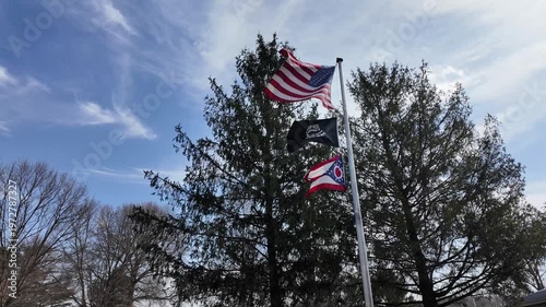 Flags of the USA and Ohio State Wave in the Wind With POW MIA Flag