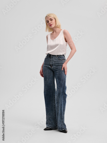 Fashion shooting in studio . Professional model , fashionable clothes and style, new collection. stylish look	