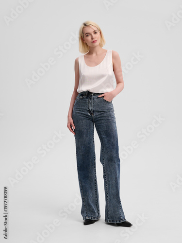 Fashion shooting in studio . Professional model , fashionable clothes and style, new collection. stylish look	