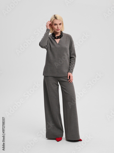 Fashion shooting in studio . Professional model , fashionable clothes and style, new collection. stylish look	