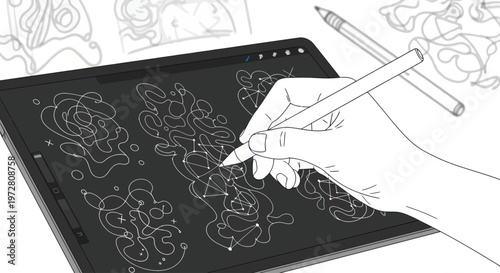Hand holding stylus on drawing tablet.