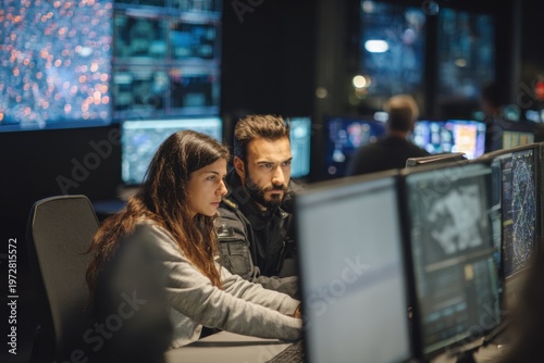Security Officers Monitoring Computer Screens in Control Room