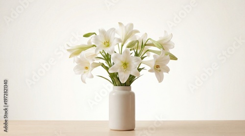 Elegant bouquet of white lilies in a simple vase on a light background