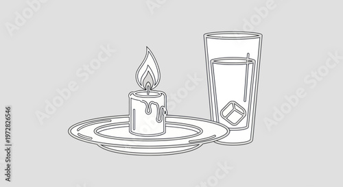 A lit candle and a glass.