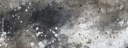 Abstract watercolor splash texture with dark and light tones and scattered white dots.