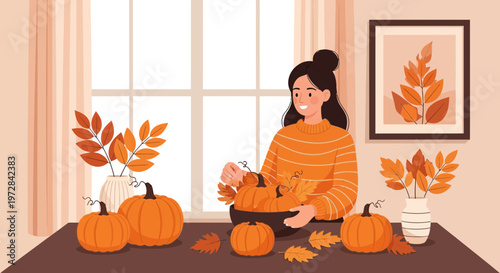 Woman happily arranging pumpkins and autumn leaves for home decoration