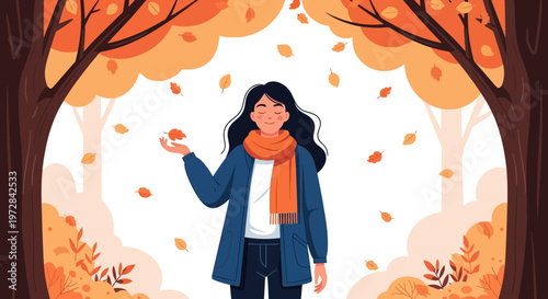 A woman in autumn enjoying falling leaves with a bright orange scarf and blue coat