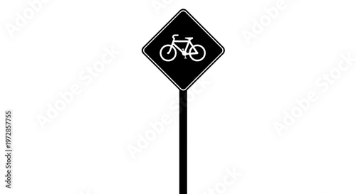 Bicycle Sign on the Road: A minimalist depiction of a bicycle sign stands tall on a road, a clear symbol for cyclists.