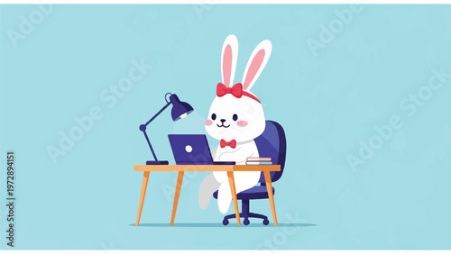 Rabbit working on laptop computer.