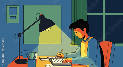 Young man studying at desk.