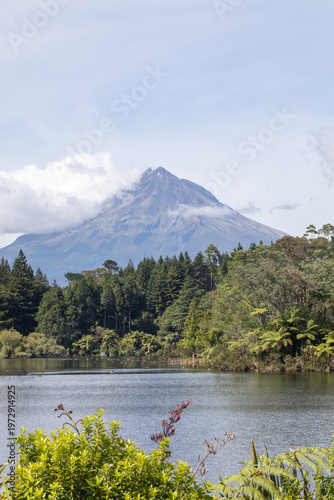 Mount Taranaki volcano landscape with forest and lake New Zealand scenic travel destination