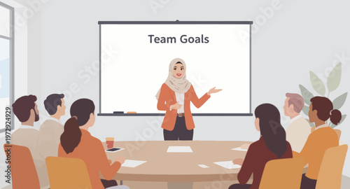 Businesswoman presenting team goals to colleagues.