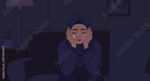 a woman sitting on a couch in a dark room.