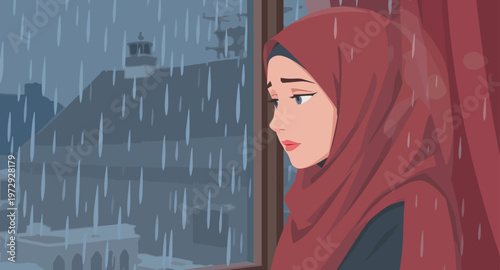 Woman in hijab looking out rainy window.