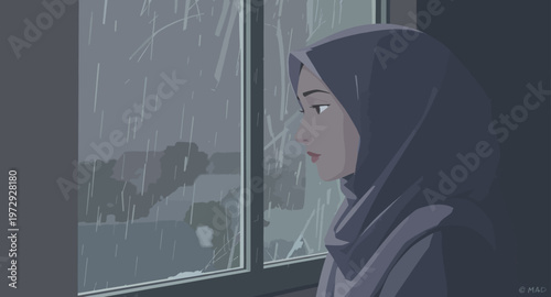 Woman in hijab looking out rainy window.