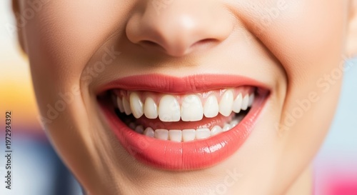 Smiling woman with healthy white teeth.