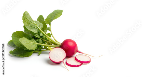 Fresh radish with green leaves and sliced cross-section on a plain background
