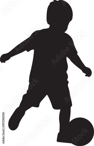 Black silhouette of a boy kicking a soccer ball child