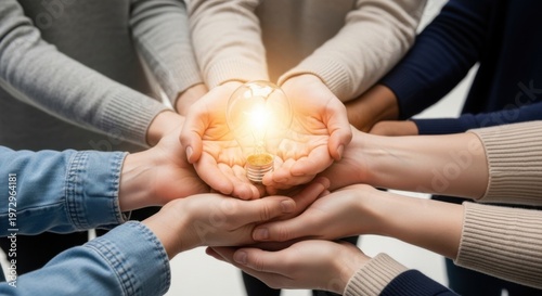 Diverse Hands Together Holding Light Bulb