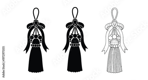 Three decorative tassels with bows and beadwork in black and white