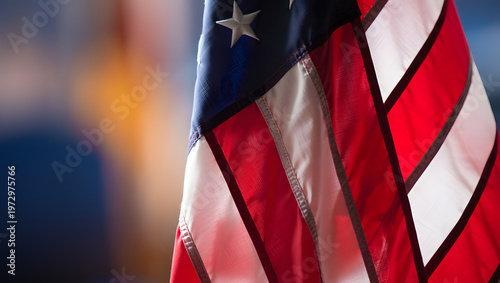 American Flag in Focus: The Stars and Stripes wave proudly, the vibrant red, white, and blue hues creating a patriotic display of national pride. Capturing a moment of unity, freedom, and strength. 
