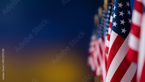 American Flags in Unity: Close-up shot of American flags waving proudly, their red and white stripes and starry blue fields representing the strength and solidarity of the nation.