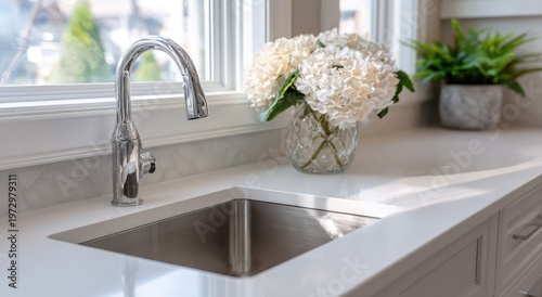 Modern Kitchen Sink with Hydrangeas and Natural Light.