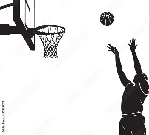 Silhouette of basketball player shooting ball into hoop