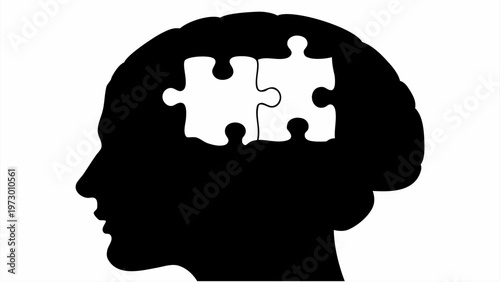 Silhouette of a human head with puzzle pieces in brain symbolizing problem solving and mental health awareness