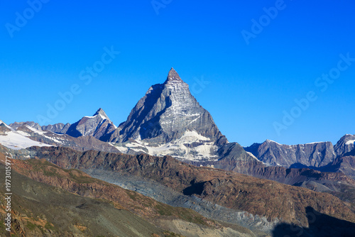 Mountain panorama with summit Matterhorn seen from mountain hut Monte Rosa Hut in summer in Swiss Alps, canton of Valais, Switzerland