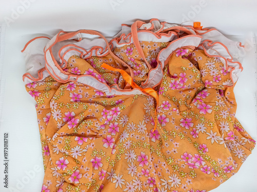 Schilderij op canvas Sexy orange babydoll lingerie with delicate floral pattern display