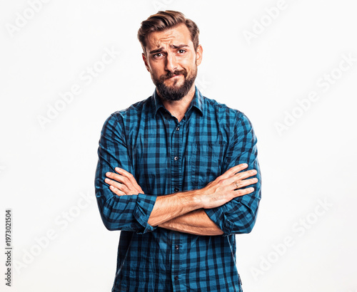 Confident man with arms crossed standing.