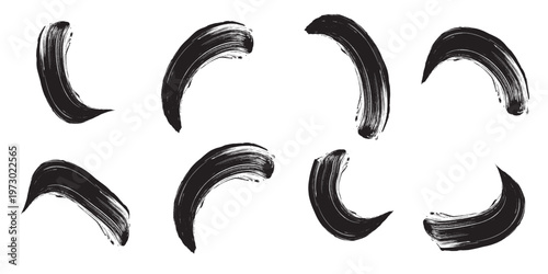 Set of black curved brush strokes artistic paint smears grunge texture elements.