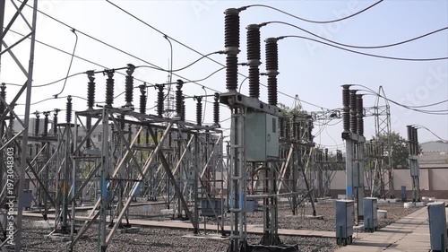 High Voltage Electrical Substation with Power Lines Insulators and Steel Framework Outdoor Grid.

