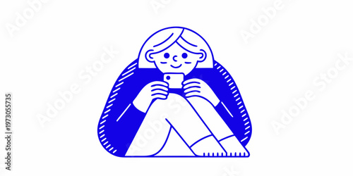 Young woman sits with knees up engrossed in her mobile phone