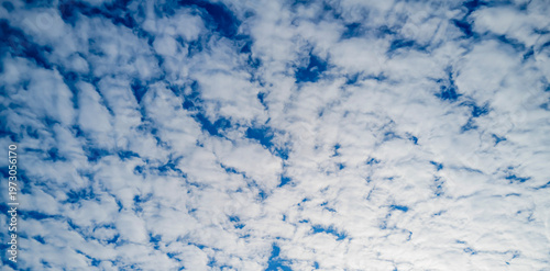 Canvas Print Sun on the puffy clouds