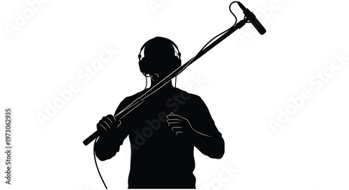 A musician with headphones and microphone performs in a striking silhouette
