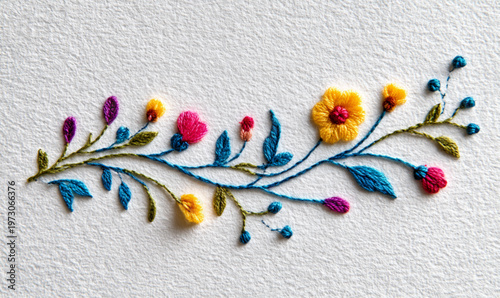 Colorful Embroidered Floral Pattern On White Fabric For Textile Design Concepts