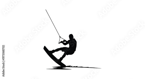 Kitesurfer riding a wave dynamic action captured in a dark silhouette