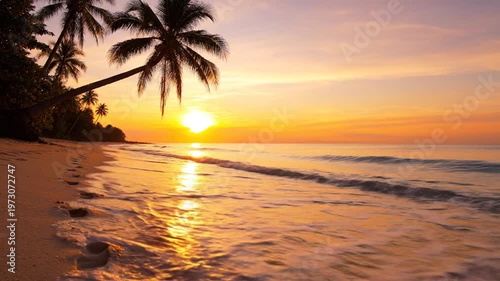 Tropical beach at sunrise with silhouette palm trees, human footprints in the sand, and gentle ocean waves washing ashore under a vibrant orange sky with golden sun reflection.