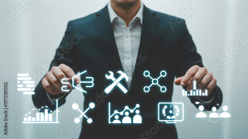 Businessman interacting with a futuristic user interface showcasing diverse business, industrial, and data visualization icons.