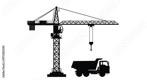 Black silhouette of a tower crane and dump truck at a construction site