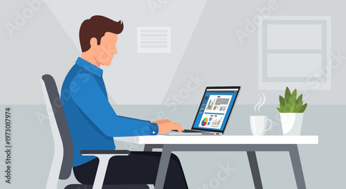 Man sitting at desk working on laptop.