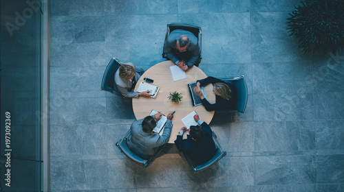 Team discussing strategy at round table, collaboration and teamwork concept