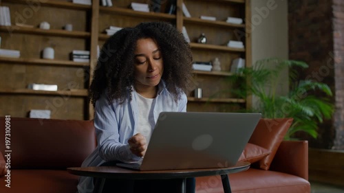 Entrepreneur Filling Online Form on Laptop