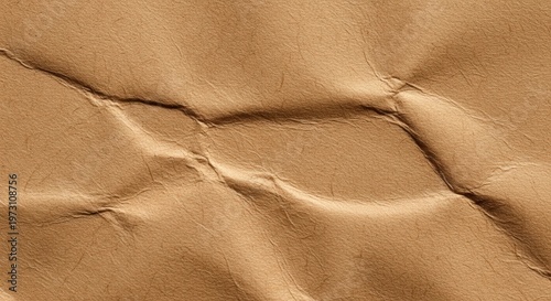 Close-up view of crumpled brown paper texture with visible creases and folds.