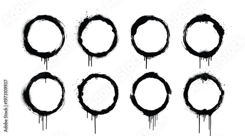 Set of black spray paint circles with drips and splatters