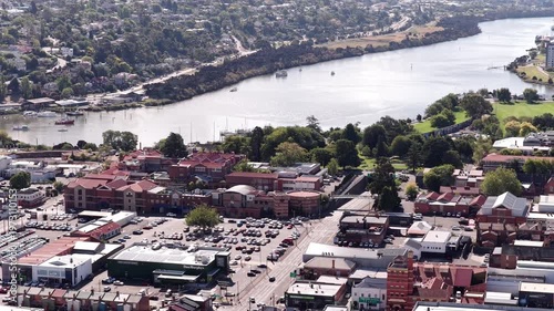 Short close up view of River Tamar origin in Launceston city of Tasmania – aerial.